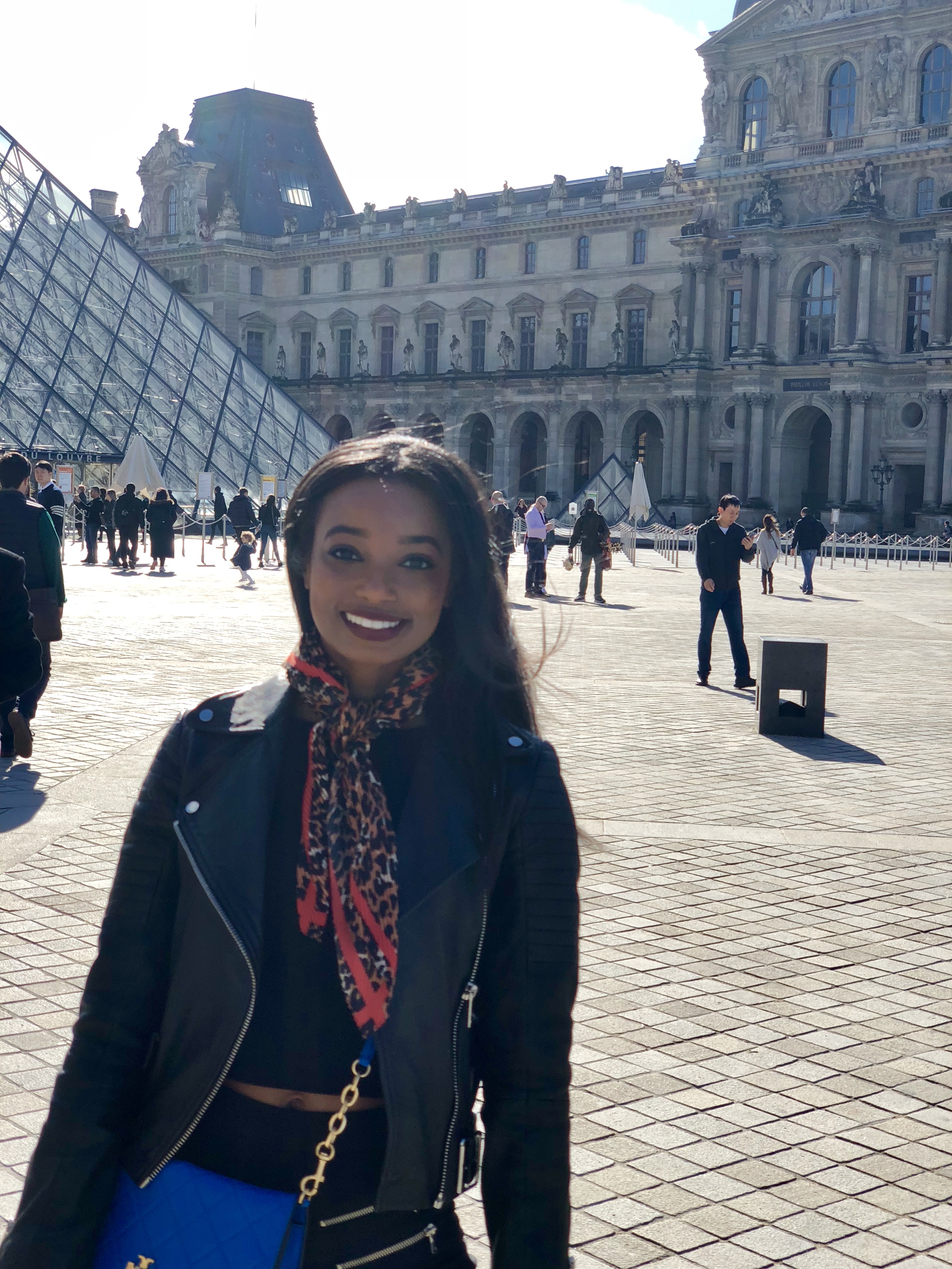 Myself in front of the famous Louvre Museum in Paris, France.